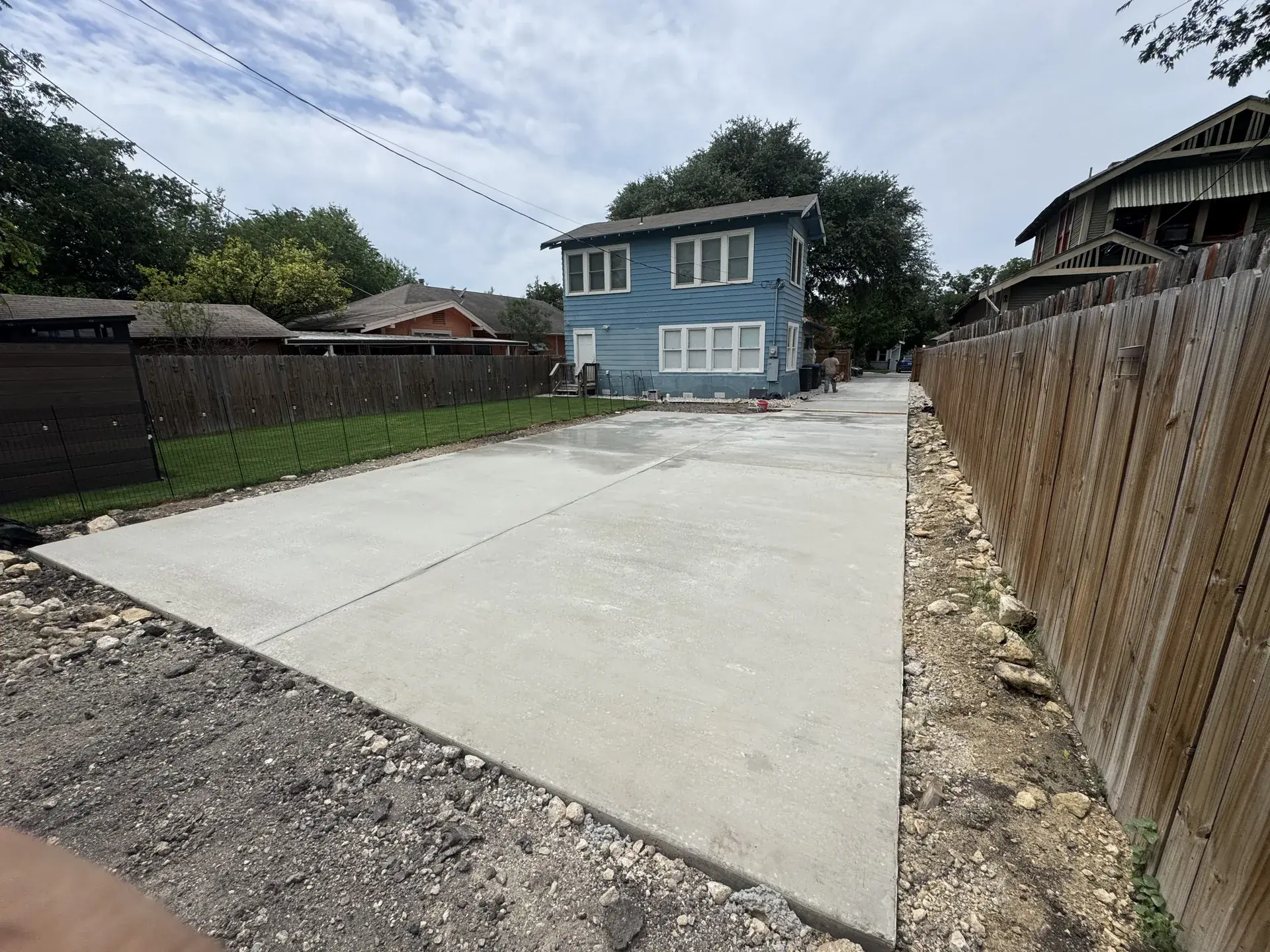 Finished concrete driveway in San Antonio, TX after the old driveway was removed