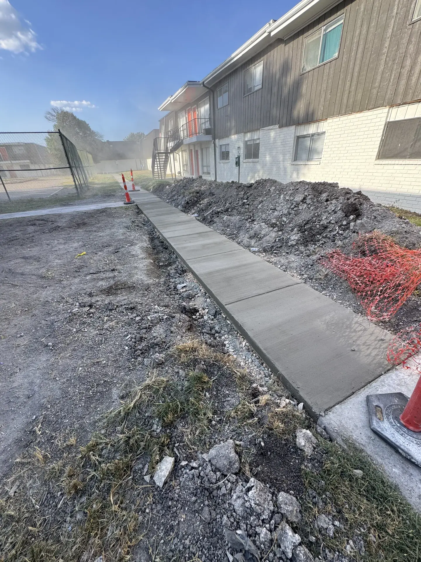 After: apartment sidewalk in San Antonio, broken concrete removed and replaced