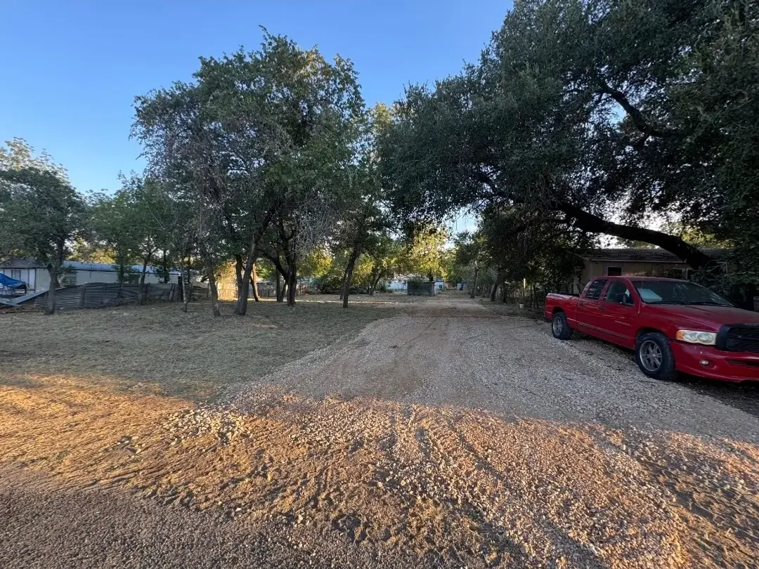 After: overgrown San Antonio lot cleared of brush and debris