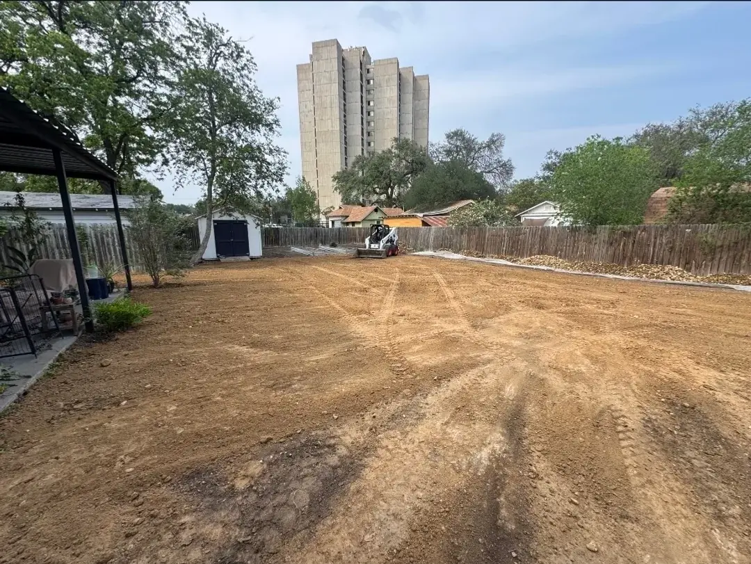 Topsoil delivered and spread on a residential lot in San Antonio by Five Star Trucking